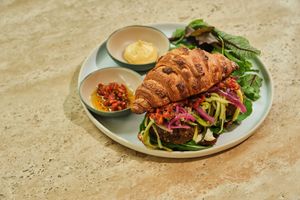 Croissant Sandwich with  Grilled Strawberry and Cashew Feta, one of our croissant delicacies. at Ethique Plant-based in Istanbul