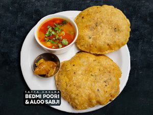 Bedmi Masala Poori and Aloo Sabji — 2 pieces stuffed lentil bread served with potato curry and pickle. at Tatta Chulha in Vancouver