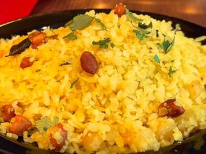Poha — Flattened rice, onions, peanuts. at Tatta Chulha in Vancouver