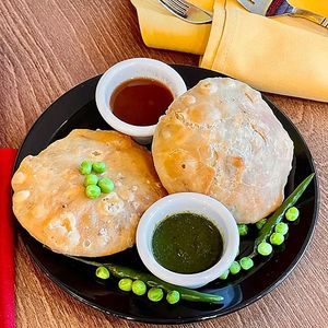 Matar Kachori — 2 deep-fried green peas puffed pastry, served with green & tamarind chutney. at Tatta Chulha in Vancouver