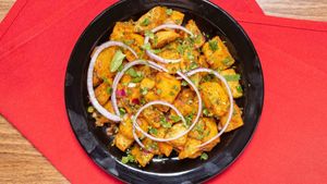 Chatpate Aalu — Deep-fried potatoes, onion, ginger, green chilli & cilantro. at Tatta Chulha in Vancouver