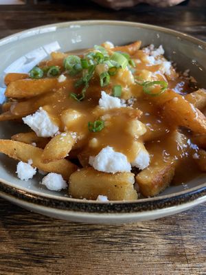 Poutine w/ vegan feta  at Iron Bay Restaurant & Drinkery in Marquette