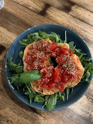 Tomato bruschetta type bagel shaped starter at Ortica Italian Plant Based in Urmston