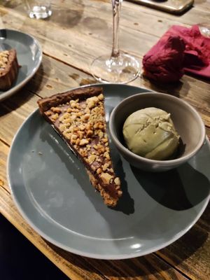Chocolate tart and pistachio icecream at Ortica Italian Plant Based in Urmston