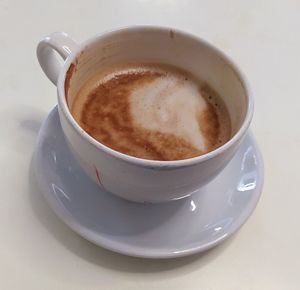 Vegan Oat Latte (the staff writes the contents on your cup and saucer) at The Ashmolean Cafe in Oxford