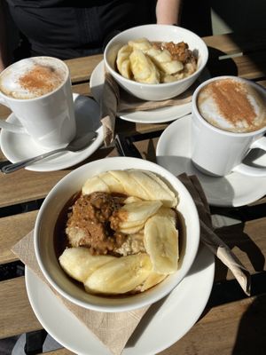Chai tea and Porridge with banana and almond butter.  at Living Room Club in North West London