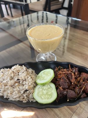 Beaten rice and seitan choila with smoothie in the background   at Hamro Vegan in Lalitpur
