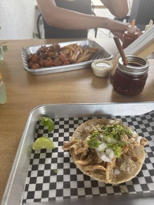 Chicharrón taco and Alitas in the backgroundd  at VegMex in La Paz