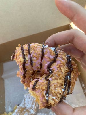 Coconut flakes with chocolate and pink frosting 🍩 at Dun-Well Doughnuts in Brooklyn