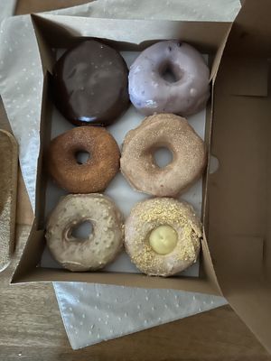 Boston cream, blueberry, apple, cinnamon sugar, pistachio, and lemon custard 😋   at Dun-Well Doughnuts in Brooklyn