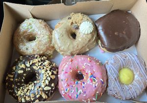 Pistachio, oatmeal raisin cookie, Boston creme, chocolate peanut, strawberry sprinkle, blueberry lavender lemon creme  at Dun-Well Doughnuts in Brooklyn