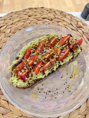 Smashed Avo on Sourdough Toast with Cherry tomatoes and mixed seeds - Vegan and refined Sugar Free  at Love Live Light Healing Hub in Cardiff