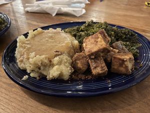 The Family Favorite: peanut butter baked tofu, mash potatoes with gravy, and sautéed kale #Veganuary at Rosetta's Kitchen in Asheville