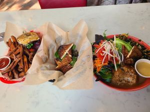house burger+sweet potatoe fries (left), tofu appetitizer (middle, forget exact name maybe the smoky tofu), buddha bowl (right) at Rosetta's Kitchen in Asheville