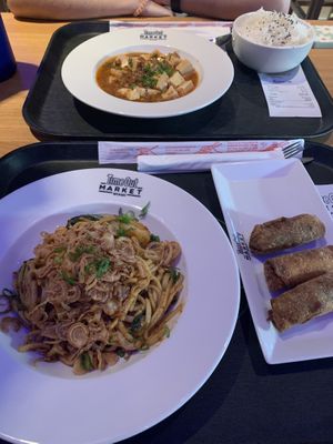 Dan Dan noodles, mapo tofu and egg rolls  at The Rogue Panda in Brooklyn