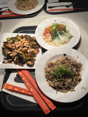 Kung Pao Brussels (left), Dan Dan Noodles (top right), Truffle Fried Rice (bottom right)  at The Rogue Panda in Brooklyn