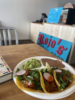 One of each taco with a side of beans and avocado. So good!  at Rojos Mexican Food in Seattle