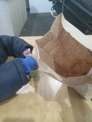 Tiny fingers greedily loving the Guacamole at Rojos Mexican Food in Seattle