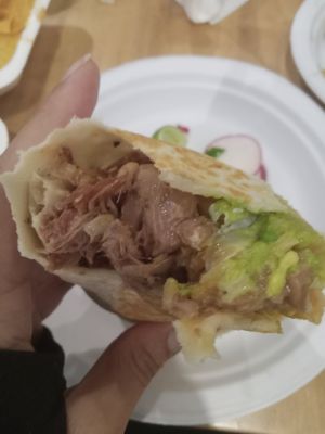 Carnitas loaded burrito absolute perfection at Rojos Mexican Food in Seattle