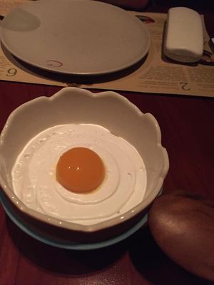 it's an egg but not an egg! sweet mango, frozen passion fruit, and whipped coconut come together in a refreshing, light dessert at Cuca in Jimbaran