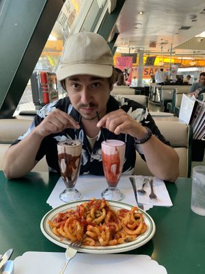 Milkshakes and curly fries   at Mel's Drive-In in West Hollywood