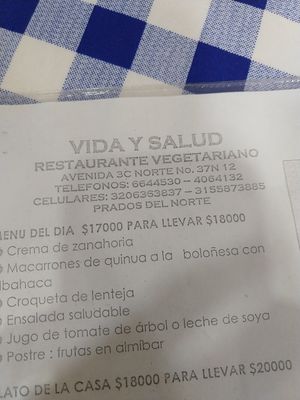 Menú with phone numbers at Vida y Salud in Cali