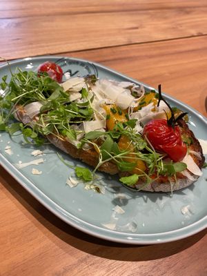 Our Italiano sandwich, a slice of bread with pesto verde, colorful antipasti, cress, chives and parmesan. at Neue Weberei in Wernau