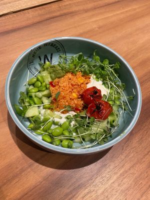 Our Neni's Best Bowl with couscous, avocado cream, yoghurt, cress, coriander, edamame, mango and ponzu. at Neue Weberei in Wernau