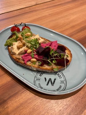 Our Mix Color sandwich, a slice of bread with beetroot hummus, beetroot, avocado, cress and nuts. at Neue Weberei in Wernau