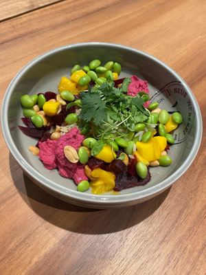 Our Poké Bowl with rice, beetroot hummus, beetroot, nuts, cress, coriander, edamame, mango and ponzu. at Neue Weberei in Wernau