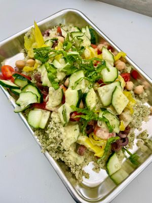 Protein pile salad with quinoa, spinach, garbanzo beans, cuke’s, tomato, kalamata, pepperoncini and lemon-herb vinaigrette at Slapped Woodfired Pizza - Pop Up in Minturn