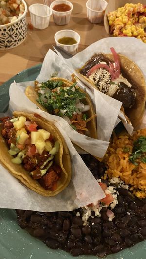 Al pastor, barbacoa and plantain with mole tacos as a platter  at Tacotarian in San Diego