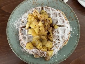 Vegan wholemeal waffle with baked apple cubes €8  at Heaven's Cafe in Naxos