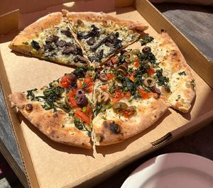 vegan wild mushroom pizza (top) and “vegani” pizza (bottom)  at Roscoe's Pizzeria in Takoma Park