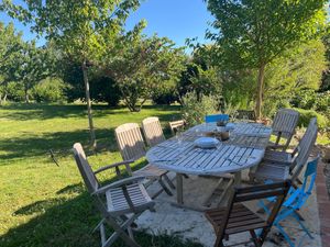 The terrace sits nicely in the shade for dinner. at La Colline aux Licornes in Montbron