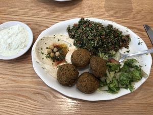 Vegetarian plate with 2 orders of tabouleh, 2 orders of falafel, hummus, and fatoush salad subbed for feta salad     at Albasha Greek & Lebanese in Covington