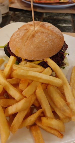 Veggie burger with fries at Caravanserai in San Sebastian