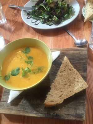 Coconut and sweet potato soup, homemade bread. at Art Cafe in Holt