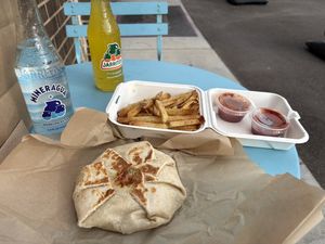 Vegan crunchwrap and fries   at Vegan Van @ Park Hill Kitchens in Denver