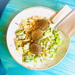Spring Falafel Grain Bowl with asparagus, broccoli, peas, chickpeas and lemon tahini  at Life Alive Organic Cafe in Cambridge