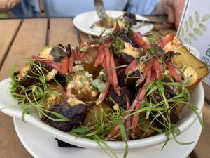 PATATAS AZULES  on the snacks menu. Big enough for an entrée! Fantastic!
fried blue gem potato, chili toum, ramp chimichurri, pickled daikon, pickled carrot, amaranth microgreens  at Jardin in Madison