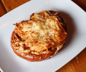 Vegan Bratzel - pretzel topped with vegan brat and dairy-free cheese (Vegetarian available) at Kansas City Bier Company in Kansas City