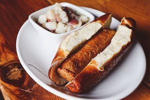 Vegan Bratwurst - served on pretzel bun; pictured with Potato Salad (vegan) at Kansas City Bier Company in Kansas City