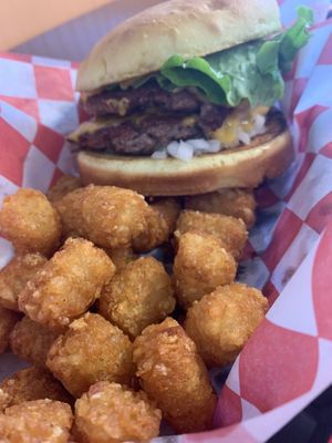 tots and mac burger omnomnomnomnom   at Romeos Vegan Burgers in Greensboro