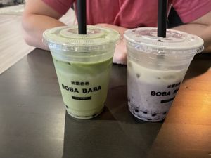 Strawberry matcha latte & blueberry corn milk (with oat milk & boba) after stirring   at Boba Baba in Cary