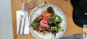 Savory toast, tofu ricotta, pesto, heirloom tomato, candied onions, shiltake, radish and enoki pickles, red pepper chutney, apricot, kale crisps at Ground to Grow in Paris