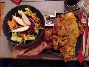 Fried cabbage roll, filled with sunflower seeds, and a seasonal side salad at Il Rosso am Schmeerhörn in Altenhof