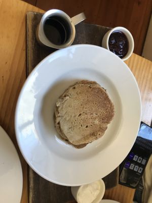 Amazing vegan oat pancakes. With berries compote, maple syrup and thick coconut yogurt! Simple but sooo good!   at Antonio's Cafe in Palmerston North