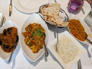 L-R aubergine bhaji, curry, roti bread, rice, chickpea curry at Ghandi Indian Restaurant in Winchester