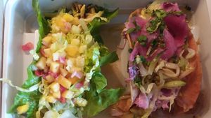 Custom vegetable tacos: one in a lettuce wrap with mango salsa, romaine and pineapple plus veggies/squash. Another in crispy corn tortilla with pickled onions, cabbage, romaine, ci at Turco Taco in Naples